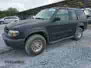 2000 Ford Explorer Sport z VIN 1FMYU60E8YUB03494, wystawiony jako Copart lot #59266395 z przebiegiem 210 925 mil mil oraz Szkoda całkowita • Salvage title. Historia ofert i sprzedaży dostępna na DreamBid. Obrazek 1.