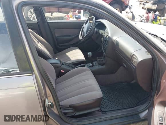 1995 Toyota Camry DX z VIN 4T1SK11E8SU586716, wystawiony jako IAAI lot #42116989 z przebiegiem 119 778 mil mil oraz . Historia ofert i sprzedaży dostępna na DreamBid. Obrazek 5.