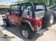 1998 Jeep Wrangler Sport z VIN 1J4FY19S9WP761133, wystawiony jako Copart lot #65012245 z przebiegiem 200 759 mil mil oraz Szkoda całkowita • Salvage title. Historia ofert i sprzedaży dostępna na DreamBid. Obrazek 2.