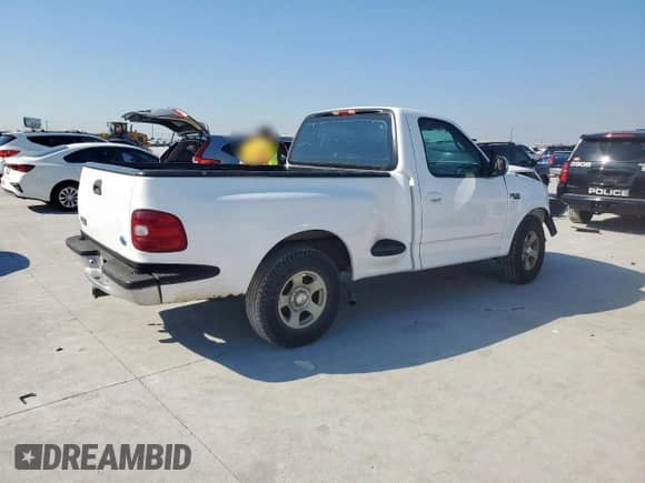 1997 Ford F-150 XL with VIN 1FTDF07WXVKA53293, listed as a Copart auction lot 84745555 with 164,151 mi miles and Salvage title. Bid and sale history available at DreamBid. Image 3.