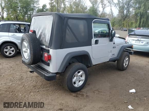 2005 Jeep Wrangler X with VIN 1J4FA39S35P323755, listed as a Copart auction lot 81223145 with 150,964 mi miles and Salvage title. Bid and sale history available at DreamBid. Image 3.