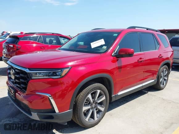 2023 Honda Pilot Touring z VIN 5FNYG2H72PB000671, wystawiony jako IAAI lot #43018124 z przebiegiem 55 569 mil mil oraz . Historia ofert i sprzedaży dostępna na DreamBid. Obrazek 2.