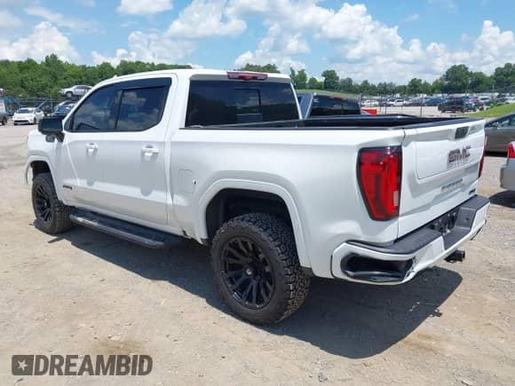 2022 GMC Sierra 1500 AT4 with VIN 1GTP9EEL3NZ130961, listed as a IAAI auction lot 42704880 with 90,866 mi miles and . Bid and sale history available at DreamBid. Image 3.