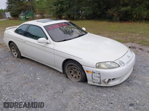 1998 Lexus SC 300 with VIN JT8CD32ZXW1003553, listed as a IAAI auction lot 43553081 with Not provided miles and . Bid and sale history available at DreamBid. Image 1.