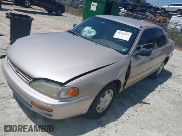 1995 Toyota Camry DX z VIN 4T1SK11EXSU631512, wystawiony jako IAAI lot #42766688 z przebiegiem 177 467 mil mil oraz . Historia ofert i sprzedaży dostępna na DreamBid. Obrazek 2.