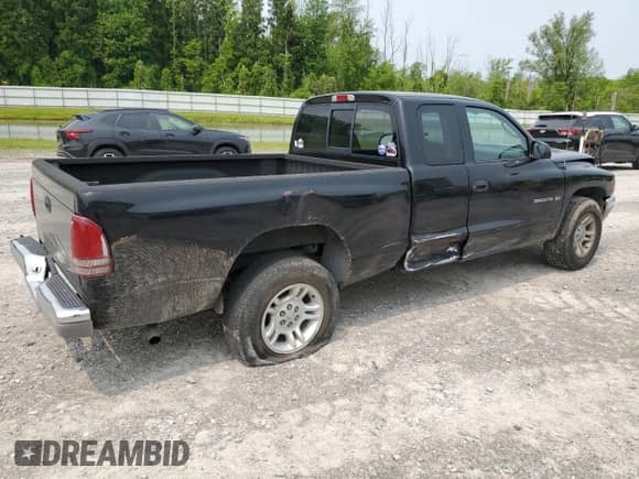 2001 Dodge Dakota с VIN 1B7GL22X21S288265, выставлен на аукционе Copart как лот 59529585 с пробегом 89 082 миль миль и Списание • Salvage title. История ставок и продаж доступна на DreamBid. Изображение 3.