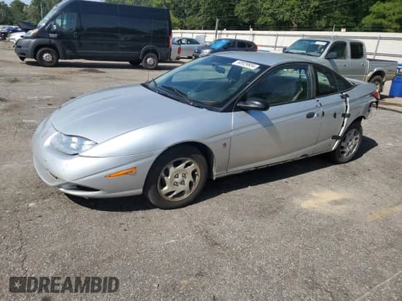 2002 Saturn SC with VIN 1G8ZP12822Z213701, listed as a Copart auction lot 68929934 with 314,042 mi miles and Salvage title. Bid and sale history available at DreamBid. Image 1.