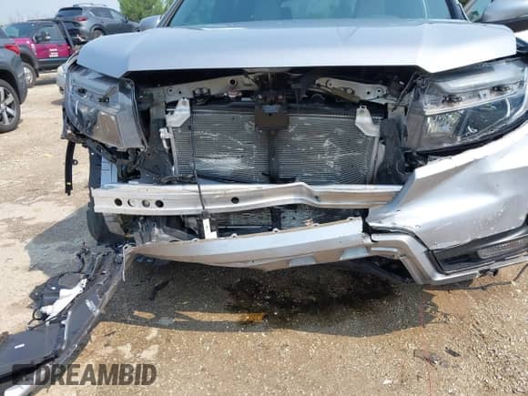2023 Honda Passport EX-L with VIN 5FNYF8H50PB019594, listed as a IAAI auction lot 42882366 with 26,120 mi miles and . Bid and sale history available at DreamBid. Image 6.