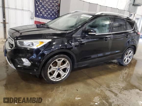2017 Ford Escape Titanium with VIN 1FMCU9J92HUA64401, listed as a Copart auction lot 65155895 with 184,708 mi miles and Salvage title. Bid and sale history available at DreamBid. Image 1.