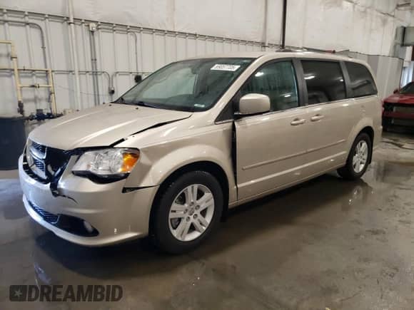2013 Dodge Grand Caravan Crew with VIN 2C4RDGDG6DR700029, listed as a Copart auction lot 69057705 with 64,797 mi miles and Salvage title. Bid and sale history available at DreamBid. Image 1.