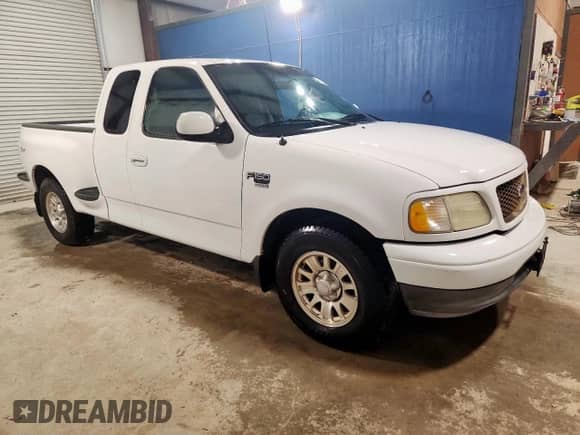 2003 Ford F-150 XL with VIN 1FTRX07W43KD62869, listed as a Copart auction lot 71248605 with 97,668 mi miles and Clean title. Bid and sale history available at DreamBid. Image 4.