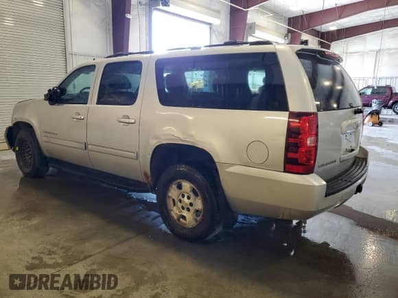 2011 Chevrolet Suburban LS with VIN 1GNSKHE37BR166073, listed as a Copart auction lot 65434585 with 145,957 mi miles and Salvage title. Bid and sale history available at DreamBid. Image 2.