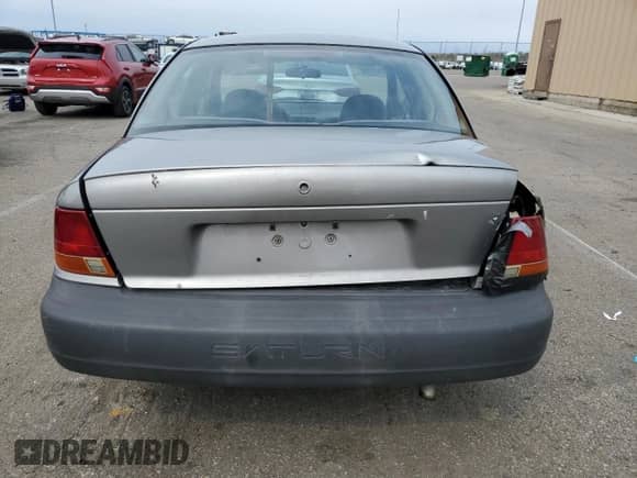 1999 Saturn SL with VIN 1G8ZH5286XZ266266, listed as a Copart auction lot 52543495 with 220,622 mi miles and Salvage title. Bid and sale history available at DreamBid. Image 6.