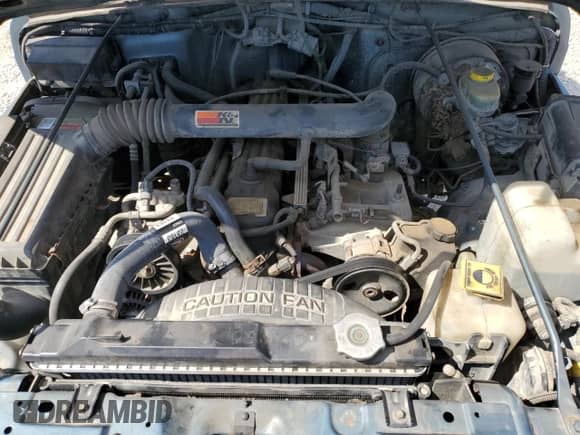 1998 Jeep Wrangler Sport z VIN 1J4FY19S9WP760919, wystawiony jako Copart lot #80940725 z przebiegiem 187 700 mil mil oraz Szkoda całkowita • Salvage title. Historia ofert i sprzedaży dostępna na DreamBid. Obrazek 11.