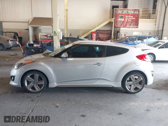 2013 Hyundai Veloster Turbo с VIN KMHTC6AEXDU145719, выставлен на аукционе IAAI как лот 43144474 с пробегом 51 191 миль миль и . История ставок и продаж доступна на DreamBid. Изображение 14.