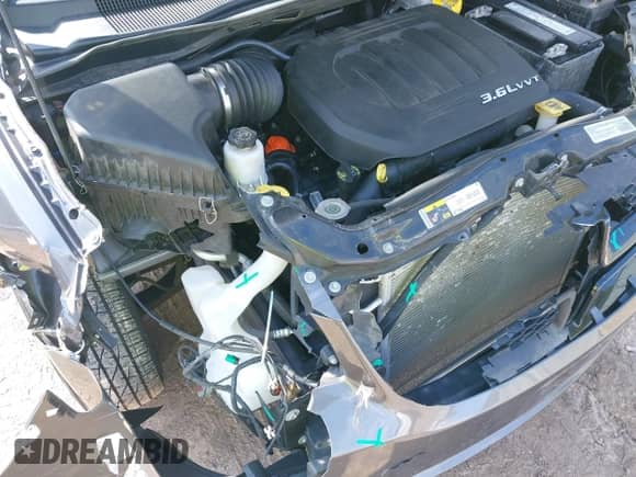 2014 Dodge Grand Caravan SE z VIN 2C4RDGBG4ER411896, wystawiony jako IAAI lot #42106651 z przebiegiem 123 321 mil mil oraz . Historia ofert i sprzedaży dostępna na DreamBid. Obrazek 6.