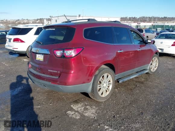 2015 Chevrolet Traverse LT with VIN 1GNKRGKD5FJ101424, listed as a IAAI auction lot 41211081 with 130,639 mi miles and . Bid and sale history available at DreamBid. Image 4.