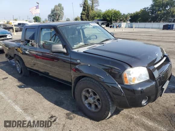 2004 Nissan Frontier XE with VIN 1N6ED27T64C477426, listed as a Copart auction lot 68329535 with 132,259 mi miles and Salvage title. Bid and sale history available at DreamBid. Image 4.