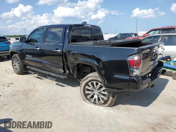 2023 Toyota Tacoma Limited с VIN 3TMEZ5CN1PM218536, выставлен на аукционе Copart как лот 56662694 с пробегом 10 217 миль миль и Списание • Salvage title. История ставок и продаж доступна на DreamBid. Изображение 2.