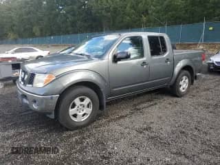 2007 Nissan Frontier LE with VIN 1N6AD07W57C433208, listed as a Copart auction lot 86180195 with 256,124 mi miles and Salvage title. Bid and sale history available at DreamBid. Image 1.