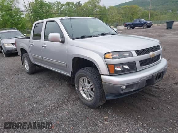 2011 Chevrolet Colorado 1LT z VIN 1GCHTCFE4B8111542, wystawiony jako IAAI lot #42168554 z przebiegiem 79 611 mil mil oraz . Historia ofert i sprzedaży dostępna na DreamBid. Obrazek 1.