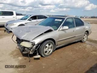 1997 Honda Accord Special Edition with VIN 1HGCD5606VA154883, listed as a Copart auction lot 58983995 with 197,774 mi miles and Salvage title. Bid and sale history available at DreamBid. Image 1.