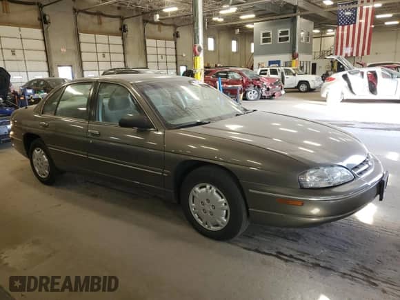 1997 Chevrolet Lumina z VIN 2G1WL52M3V9322622, wystawiony jako Copart lot #76495614 z przebiegiem 86 187 mil mil oraz Czysty tytuł • Clean title. Historia ofert i sprzedaży dostępna na DreamBid. Obrazek 4.