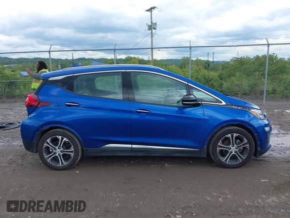 2018 Chevrolet Bolt EV Premier with VIN 1G1FX6S00J4119983, listed as a IAAI auction lot 42340718 with 58,452 mi miles and . Bid and sale history available at DreamBid. Image 14.