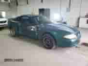 1996 Ford Mustang with VIN 1FALP4047TF229334, listed as a Copart auction lot 49257335 with 184,986 mi miles and Salvage title. Bid and sale history available at DreamBid. Image 4.