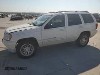 2002 Jeep Grand Cherokee Limited with VIN 1J4GX58N12C282300, listed as a Copart auction lot 74939754 with 166,018 mi miles and Salvage title. Bid and sale history available at DreamBid. Image 1.