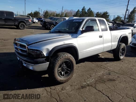 2004 Dodge Dakota Sport with VIN 1D7HG32N54S749241, listed as a Copart auction lot 86437084 with 94,879 mi miles and Salvage title. Bid and sale history available at DreamBid. Image 1.