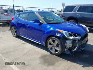 2014 Hyundai Veloster Turbo with VIN KMHTC6AE9EU186599, listed as a IAAI auction lot 42598538 with 99,781 mi miles and . Bid and sale history available at DreamBid. Image 1.