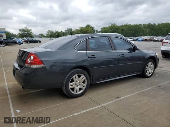 2013 Chevrolet Impala LT с VIN 2G1WG5E3XD1191225, выставлен на аукционе Copart как лот 70049725 с пробегом 176 099 миль миль и Списание • Salvage title. История ставок и продаж доступна на DreamBid. Изображение 3.