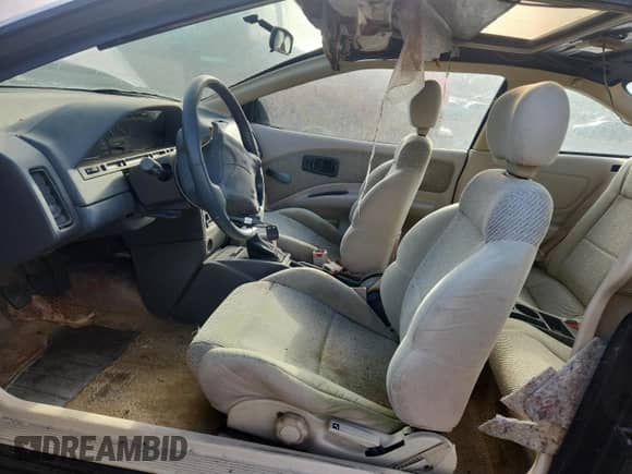 1994 Saturn SC with VIN 1G8ZG1575RZ133631, listed as a Copart auction lot 85352545 with 84,474 mi miles and Salvage title. Bid and sale history available at DreamBid. Image 7.