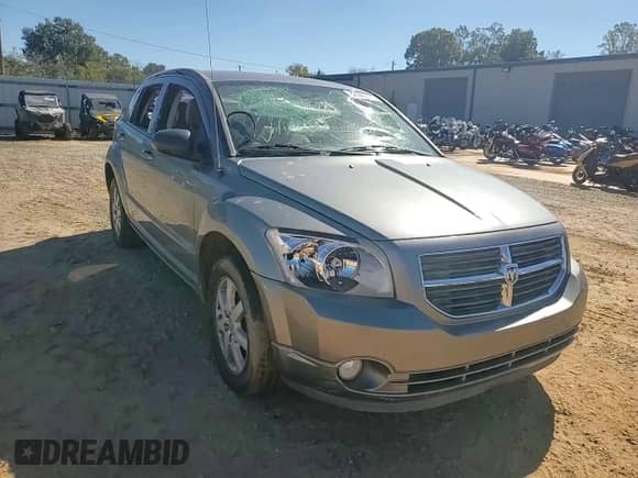 2011 Dodge Caliber Mainstreet with VIN 1B3CB3HAXBD261722, listed as a Copart auction lot 82446015 with 151,548 mi miles and Salvage title. Bid and sale history available at DreamBid. Image 13.
