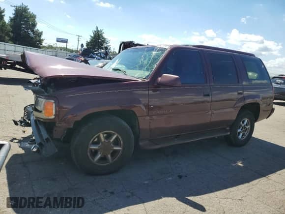 2000 Cadillac Escalade with VIN 1GYEK13R3YR109943, listed as a Copart auction lot 70992205 with 212,427 mi miles and Salvage title. Bid and sale history available at DreamBid. Image 1.