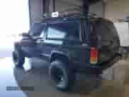 1998 Jeep Grand Cherokee with VIN 1J4FJ27P2WL203592, listed as a Copart auction lot 82803884 with 82,604 mi miles and Salvage title. Bid and sale history available at DreamBid. Image 2.