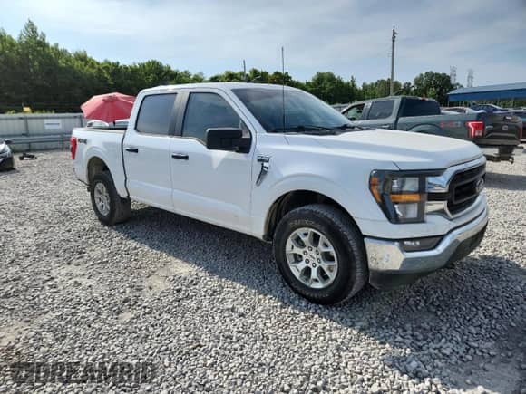 2023 Ford F-150 Lariat with VIN 1FTFW1E89PFA91516, listed as a Copart auction lot 61666315 with 65,711 mi miles and Salvage title. Bid and sale history available at DreamBid. Image 4.