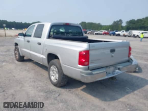 2006 Dodge Dakota SLT with VIN 1D7HE48K96S533601, listed as a IAAI auction lot 42409723 with 128,591 mi miles and . Bid and sale history available at DreamBid. Image 3.