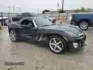2009 Saturn Sky Red Line with VIN 1G8MG35X39Y106052, listed as a Copart auction lot 69893854 with 124,937 mi miles and Salvage title. Bid and sale history available at DreamBid. Image 4.