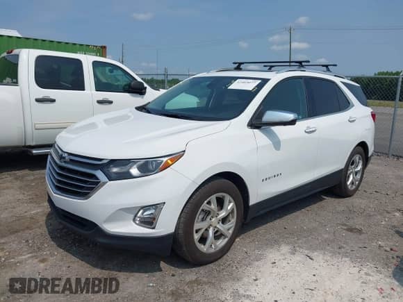 2021 Chevrolet Equinox Premier with VIN 3GNAXNEV1MS158581, listed as a IAAI auction lot 42403077 with 116,161 mi miles and . Bid and sale history available at DreamBid. Image 2.