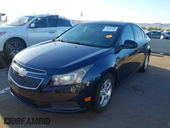 2014 Chevrolet Cruze 1LT z VIN 1G1PC5SB0E7306270, wystawiony jako IAAI lot #43335671 z przebiegiem 125 429 mil mil oraz . Historia ofert i sprzedaży dostępna na DreamBid. Obrazek 18.