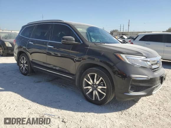 2022 Honda Pilot Touring 8-Passenger with VIN 5FNYF5H94NB004398, listed as a Copart auction lot 77202174 with 35,787 mi miles and Salvage title. Bid and sale history available at DreamBid. Image 4.