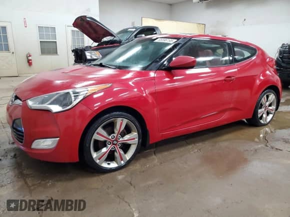 2012 Hyundai Veloster w/Black Int z VIN KMHTC6AD3CU049324, wystawiony jako Copart lot #85596195 z przebiegiem 171 178 mil mil oraz Szkoda całkowita • Salvage title. Historia ofert i sprzedaży dostępna na DreamBid. Obrazek 1.