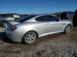 2008 Hyundai Tiburon GT с VIN KMHHN66F98U278981, выставлен на аукционе Copart как лот 85431754 с пробегом 82 764 миль миль и Списание • Salvage title. История ставок и продаж доступна на DreamBid. Изображение 3.