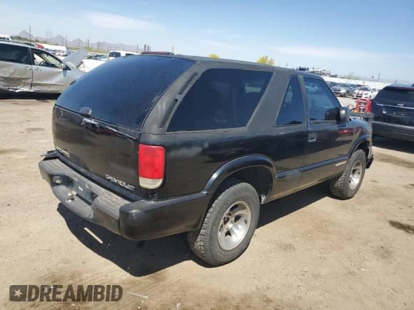 2001 Chevrolet Blazer LS с VIN 1GNCS18W11K162318, выставлен на аукционе Copart как лот 52618405 с пробегом 257 853 миль миль и Списание • Salvage title. История ставок и продаж доступна на DreamBid. Изображение 3.