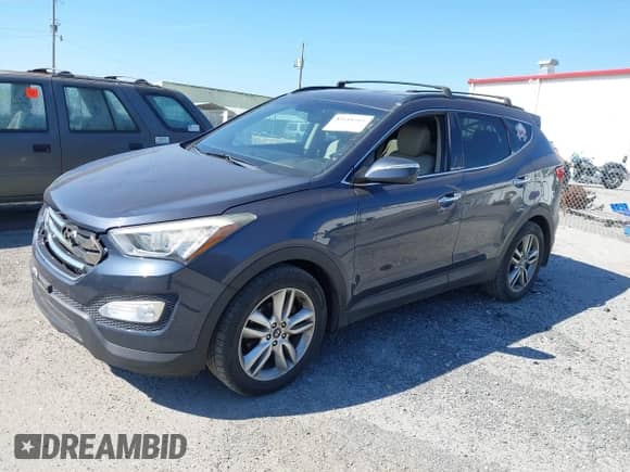 2014 Hyundai Santa Fe with VIN 5XYZU3LA0EG175108, listed as a IAAI auction lot 43118545 with 138,679 mi miles and . Bid and sale history available at DreamBid. Image 2.