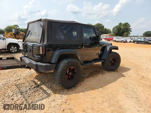 2014 Jeep Wrangler Sport with VIN 1C4AJWAG7EL200220, listed as a Copart auction lot 71811455 with 127,936 mi miles and Salvage title. Bid and sale history available at DreamBid. Image 3.