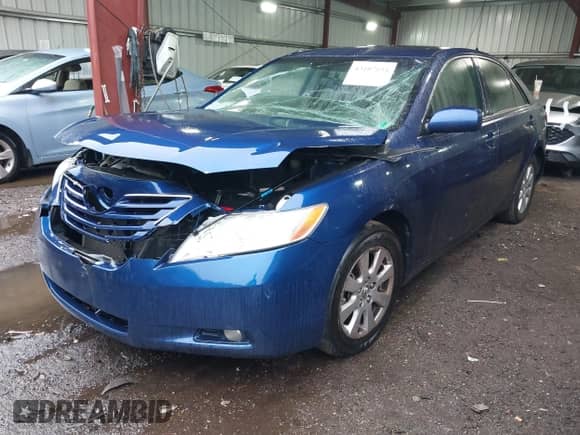2007 Toyota Camry XLE with VIN 4T1BK46K77U030310, listed as a IAAI auction lot 43187034 with 173,453 mi miles and . Bid and sale history available at DreamBid. Image 2.