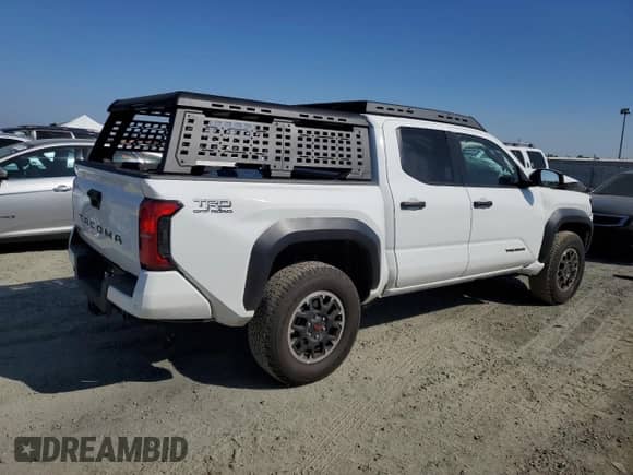 2024 Toyota Tacoma SR5 with VIN 3TMLB5JN4RM050957, listed as a Copart auction lot 71130595 with 1,873 mi miles and Salvage title. Bid and sale history available at DreamBid. Image 3.
